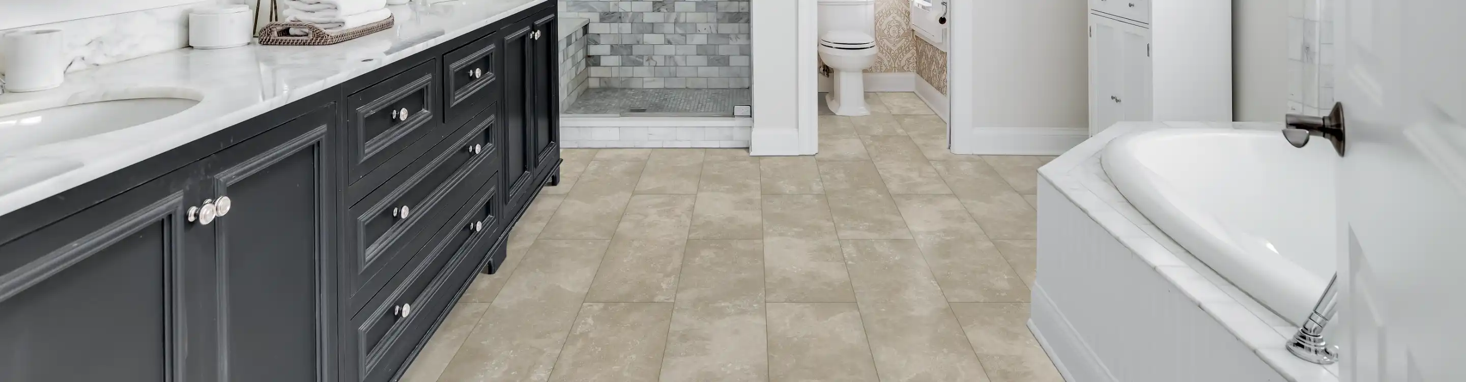 TIle flooring in a bathroom with custom shower 